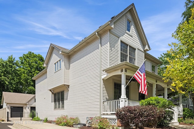 128 W Windsor Ave, Lombard, IL 60148 - view of side of home featuring covered porch, an outdoor structure, and a garage
