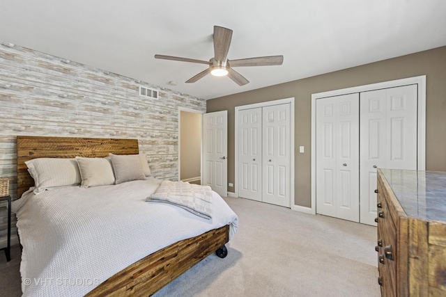 128 W Windsor Ave, Lombard, IL 60148 - bedroom featuring multiple closets, light colored carpet, and ceiling fan