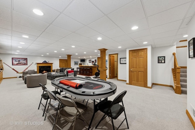 128 W Windsor Ave, Lombard, IL 60148 - dining area featuring light carpet, stairs, a warm lit fireplace, ornate columns, and recessed lighting