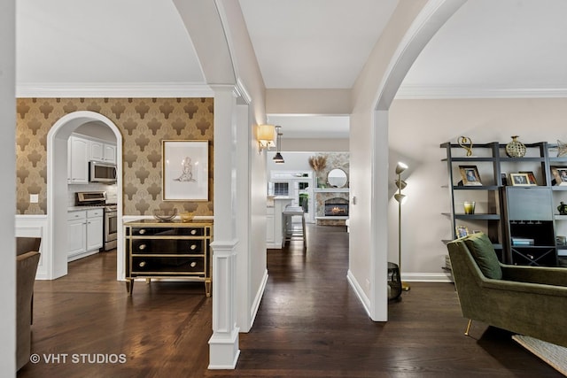 128 W Windsor Ave, Lombard, IL 60148 - hall featuring arched walkways, dark wood finished floors, wallpapered walls, and ornamental molding
