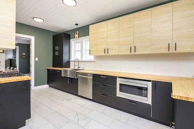 296 N Addison Ave, Elmhurst, IL 60126 - kitchen with wooden counters, stainless steel appliances, light marble finish flooring, dark cabinets, and recessed lighting