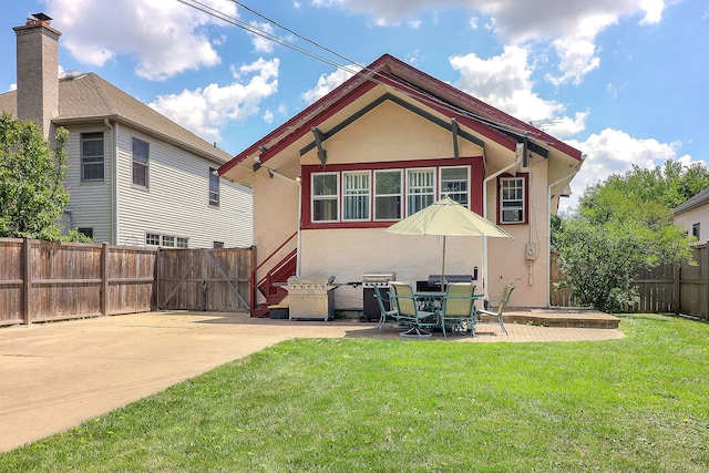 296 N Addison Ave, Elmhurst, IL 60126 - back of house featuring a patio, stucco siding, a fenced backyard, and a gate