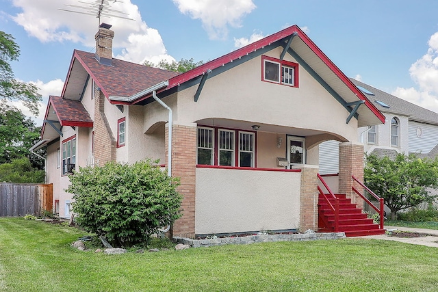 296 N Addison Ave, Elmhurst, IL 60126 - view of front of house with stucco siding, a chimney, and roof with shingles