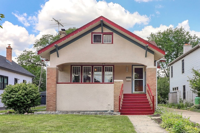 296 N Addison Ave, Elmhurst, IL 60126 - view of front facade featuring stucco siding and a front lawn
