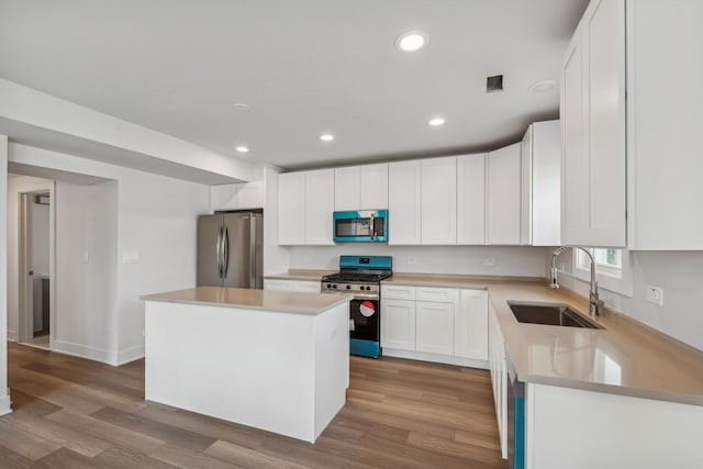 3529 S 54th Ave, Cicero, IL 60804 - kitchen featuring stainless steel appliances, wood finished floors, white cabinetry, recessed lighting, and light countertops