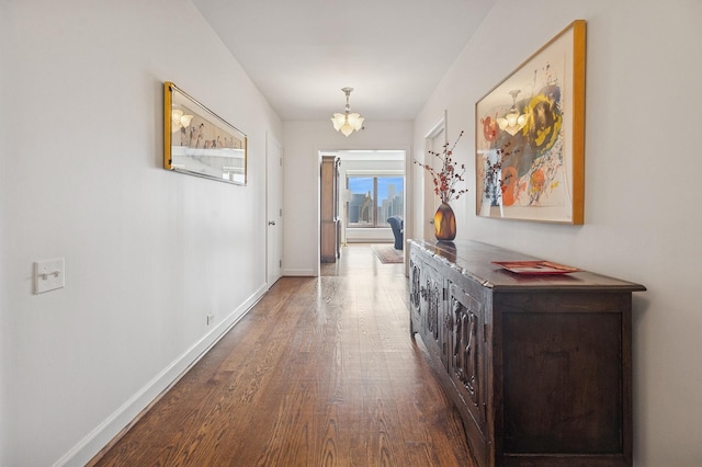161 E Chicago Ave Unit 29De, Chicago, IL 60611 - corridor featuring dark wood-style flooring and a chandelier