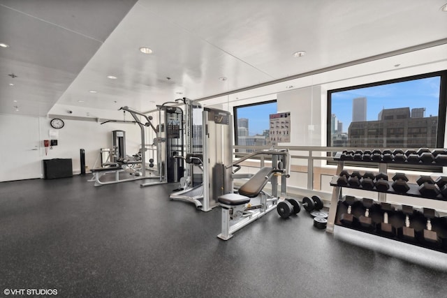 161 E Chicago Ave Unit 29De, Chicago, IL 60611 - workout area with a view of city, expansive windows, and recessed lighting