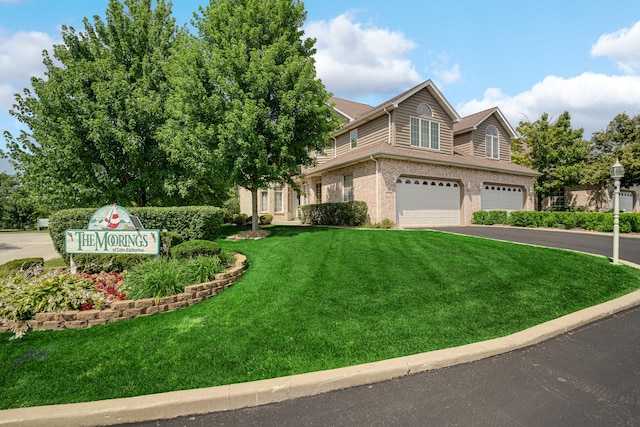 1 Moorings Dr, Palos Heights, IL 60463 - view of front of house featuring driveway, a garage, a front yard, and brick siding