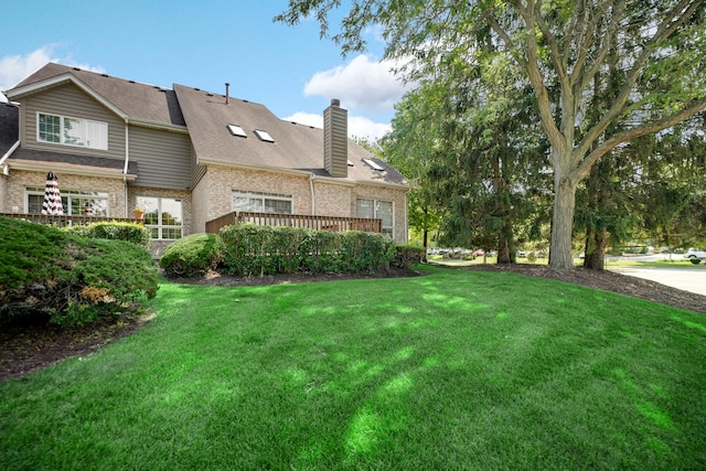 1 Moorings Dr, Palos Heights, IL 60463 - rear view of house featuring brick siding, a lawn, and a chimney