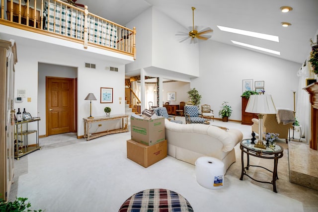 1 Moorings Dr, Palos Heights, IL 60463 - carpeted living area featuring high vaulted ceiling, stairs, ceiling fan, and a skylight