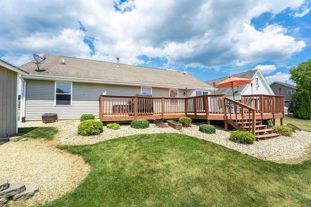 2030 Southfield Ln, Byron, IL 61010 - rear view of property with a deck, a yard, and a shingled roof