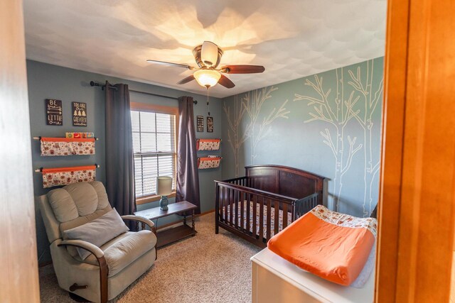 2030 Southfield Ln, Byron, IL 61010 - carpeted bedroom with a nursery area, ceiling fan, and wallpapered walls