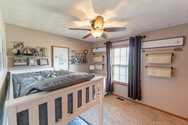2030 Southfield Ln, Byron, IL 61010 - carpeted bedroom with baseboards and ceiling fan