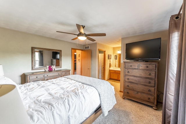 2030 Southfield Ln, Byron, IL 61010 - bedroom with light colored carpet, a ceiling fan, and ensuite bath