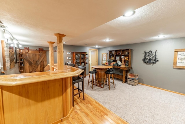 2030 Southfield Ln, Byron, IL 61010 - indoor dry bar featuring recessed lighting, light wood finished floors, a textured ceiling, and light carpet