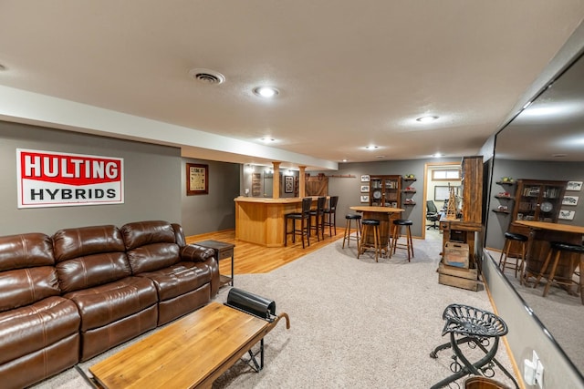 2030 Southfield Ln, Byron, IL 61010 - living area with bar with sink, light carpet, and recessed lighting