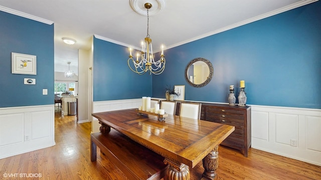 0N488 Baker Dr, Geneva, IL 60134 - dining area with a chandelier, a wainscoted wall, wood finished floors, ornamental molding, and a decorative wall