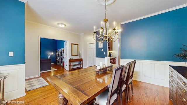 0N488 Baker Dr, Geneva, IL 60134 - dining space with light wood-type flooring, a chandelier, wainscoting, and ornamental molding
