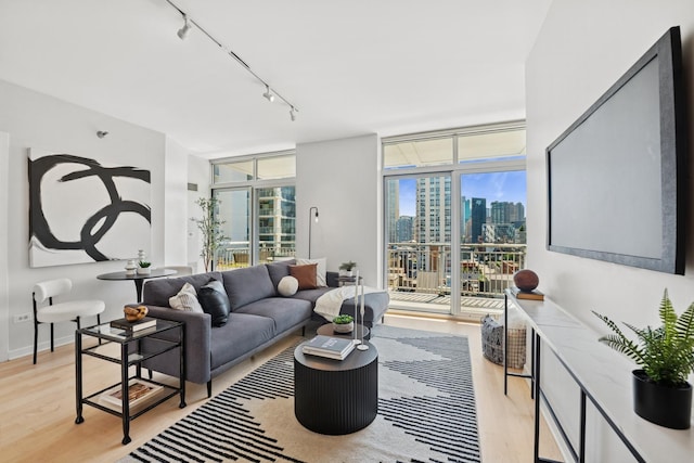 330 W Grand Ave Unit 1307, Chicago, IL 60654 - living area with rail lighting, floor to ceiling windows, and light wood-style floors