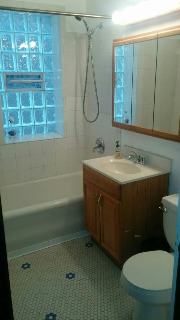 2244 W Augusta Blvd, Chicago, IL 60622 - bathroom featuring vanity,  shower combination, and tile patterned flooring