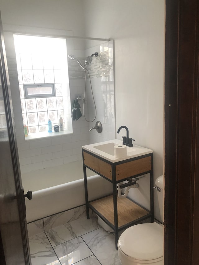 2244 W Augusta Blvd, Chicago, IL 60622 - full bath featuring shower / bathtub combination, marble finish floors, and vanity