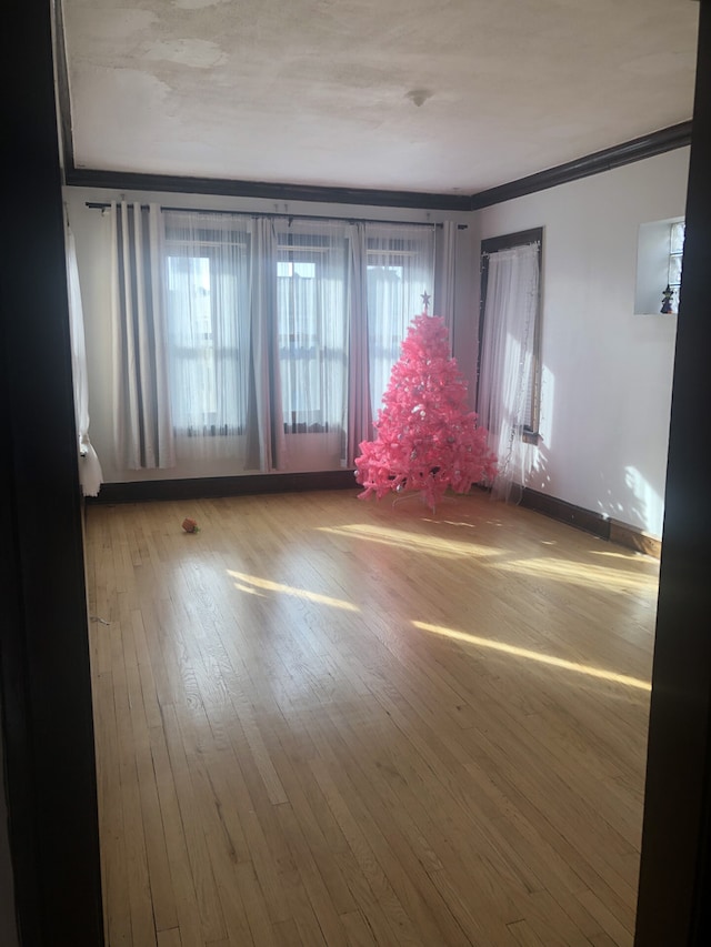 2244 W Augusta Blvd, Chicago, IL 60622 - spare room with ornamental molding and hardwood / wood-style flooring