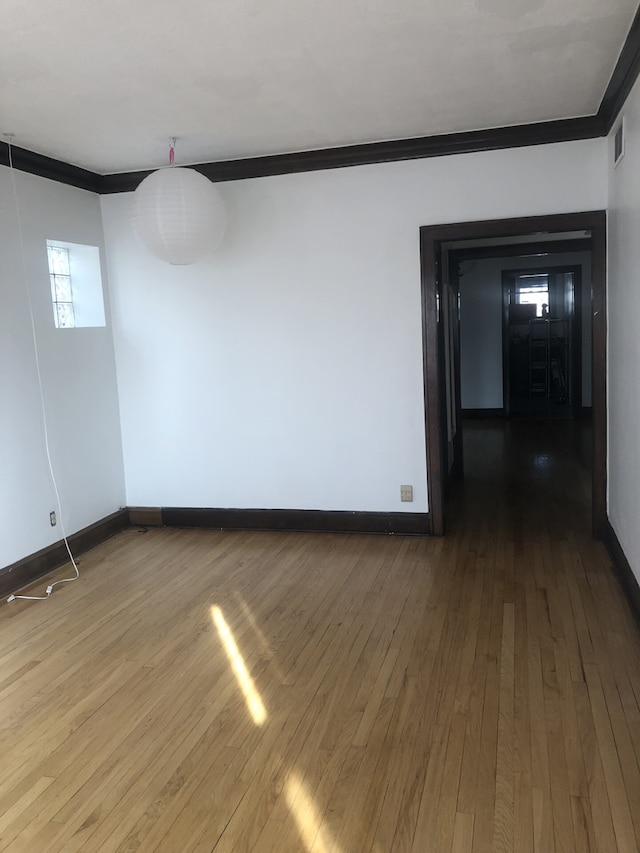 2244 W Augusta Blvd, Chicago, IL 60622 - empty room featuring crown molding and hardwood / wood-style floors