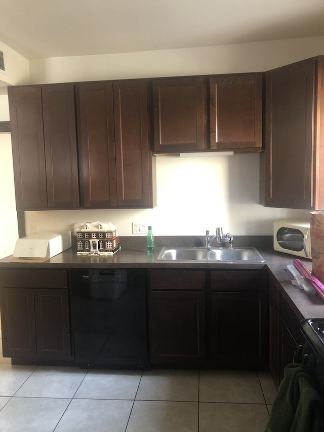2244 W Augusta Blvd, Chicago, IL 60622 - kitchen featuring black dishwasher, dark countertops, light tile patterned floors, and dark brown cabinets