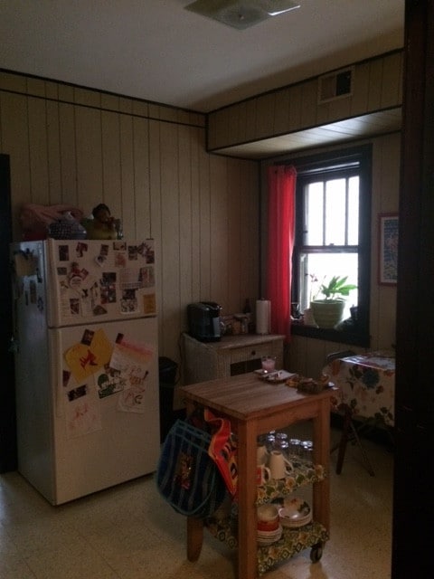 2244 W Augusta Blvd, Chicago, IL 60622 - dining space featuring light floors and wooden walls