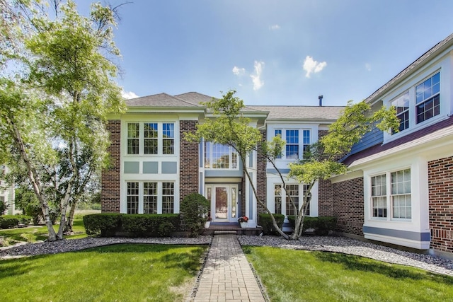 2114 Birchwood Ln, Buffalo Grove, IL 60089 - view of front of house with a front yard and brick siding