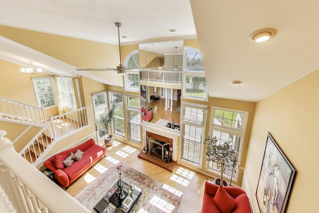2114 Birchwood Ln, Buffalo Grove, IL 60089 - living room with plenty of natural light, a high ceiling, a tile fireplace, a ceiling fan, and wood finished floors