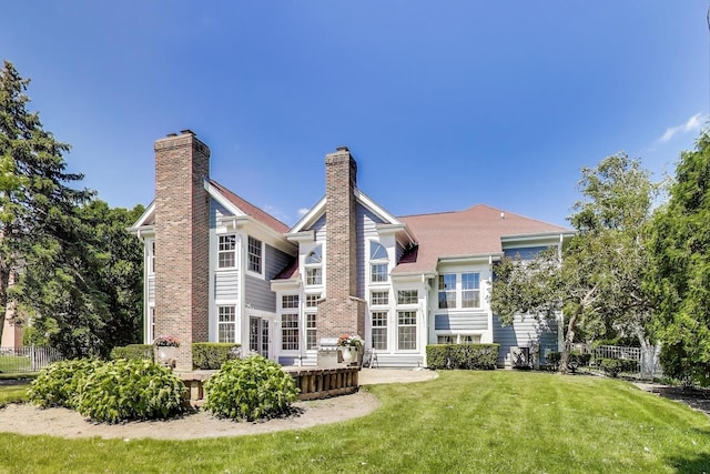 2114 Birchwood Ln, Buffalo Grove, IL 60089 - rear view of property with a chimney