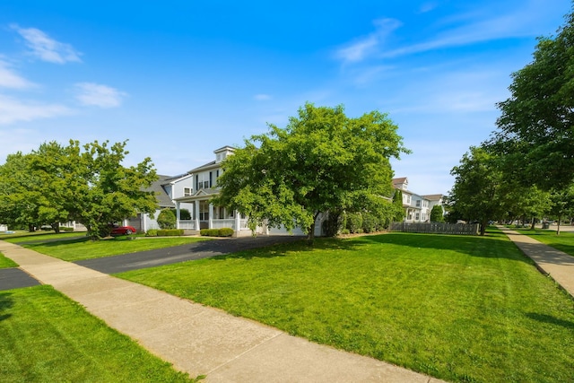 1616 Sutton Pl, Bolingbrook, IL 60490 - obstructed view of property featuring a front lawn and a residential view