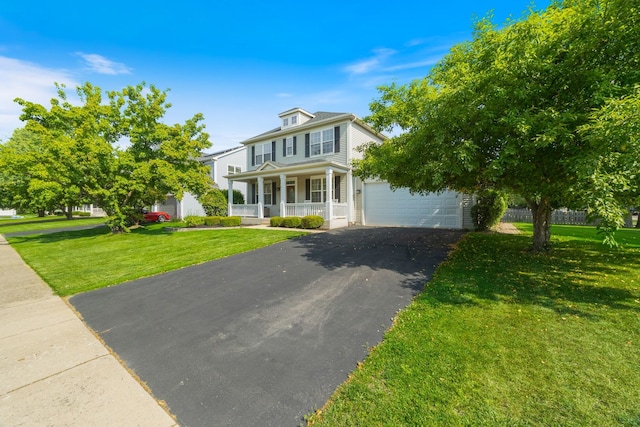 1616 Sutton Pl, Bolingbrook, IL 60490 - american foursquare style home with covered porch, driveway, a garage, and a front yard