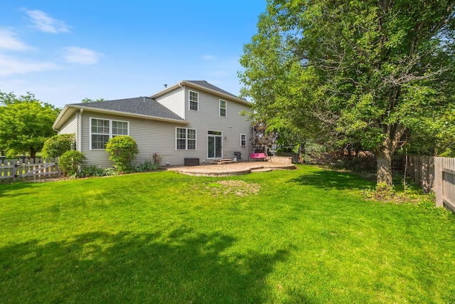 1616 Sutton Pl, Bolingbrook, IL 60490 - back of house with a fenced backyard, a patio, and a shingled roof