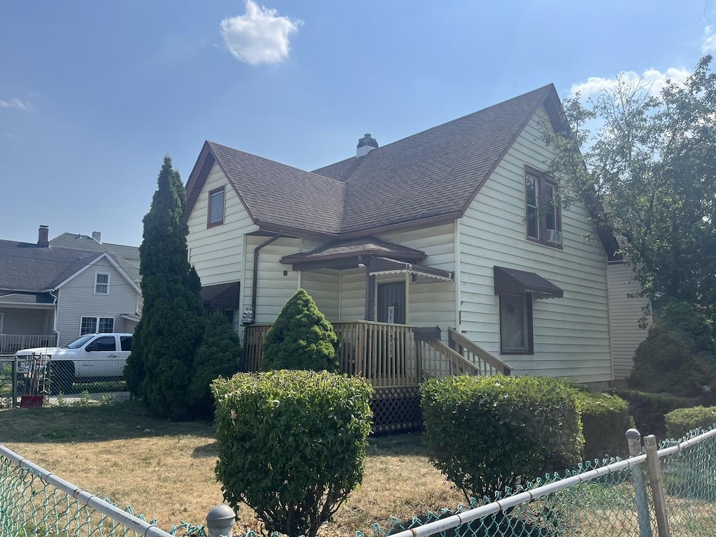 514 E Jackson St, Joliet, IL 60432 - view of front of home with a shingled roof and a chimney