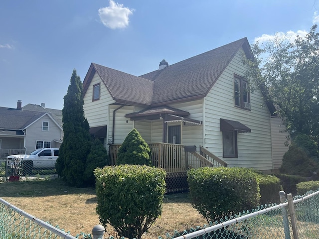 514 E Jackson St, Joliet, IL 60432 - view of front of home with a shingled roof and a chimney