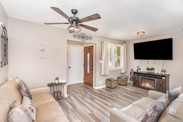9049 Barberry Ln, Hickory Hills, IL 60457 - living room featuring light wood-style flooring, ceiling fan, and a glass covered fireplace