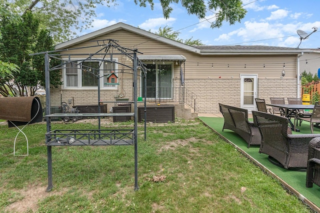 9049 Barberry Ln, Hickory Hills, IL 60457 - back of house with a lawn and outdoor dining space