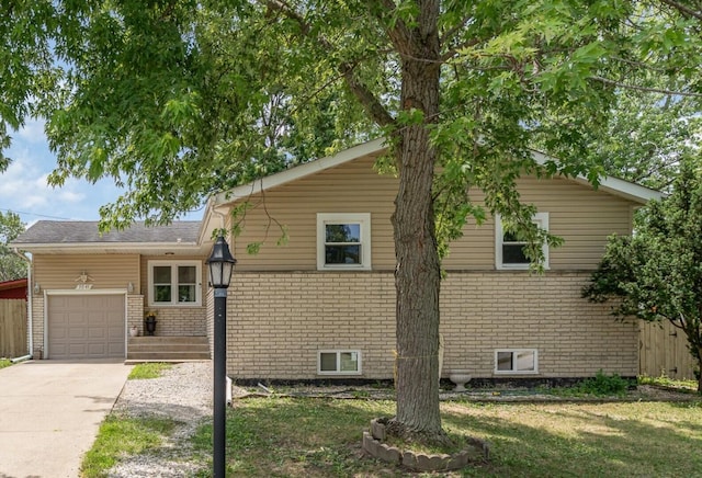 9049 Barberry Ln, Hickory Hills, IL 60457 - view of home's exterior featuring brick siding, an attached garage, concrete driveway, and a lawn