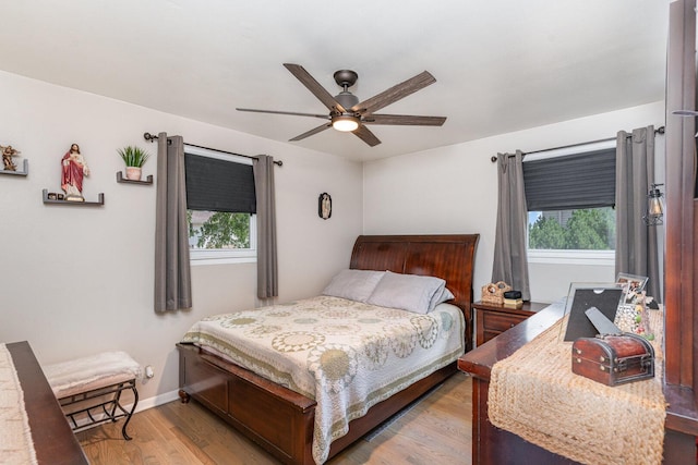 9049 Barberry Ln, Hickory Hills, IL 60457 - bedroom featuring multiple windows, wood finished floors, and a ceiling fan