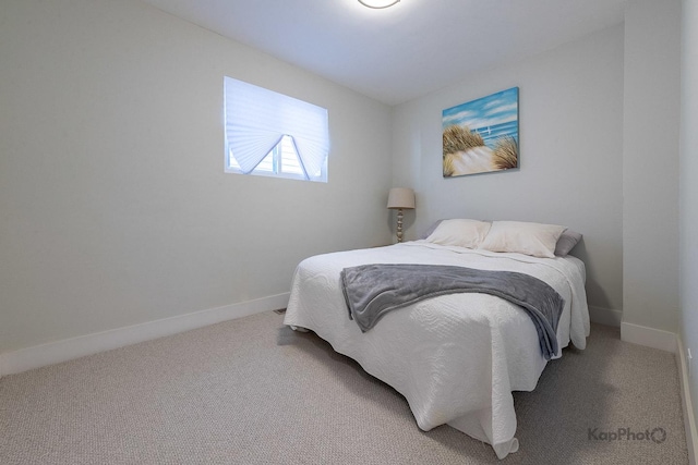 9130 S Greenwood Ave, Chicago, IL 60619 - bedroom featuring baseboards and light carpet
