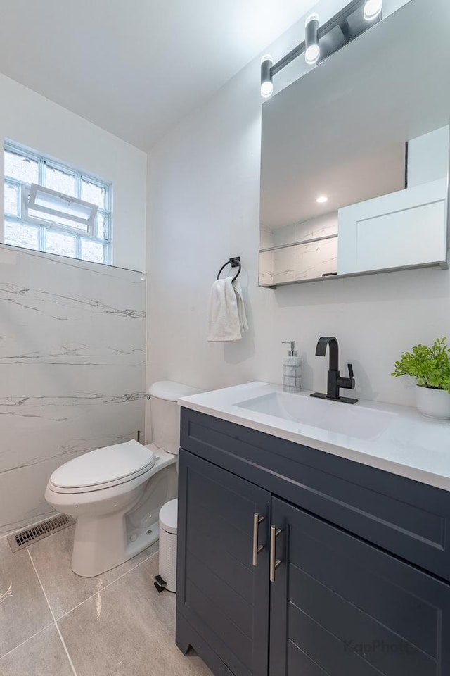9130 S Greenwood Ave, Chicago, IL 60619 - bathroom with vanity, tile patterned flooring, and tile walls