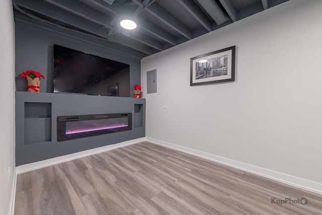9130 S Greenwood Ave, Chicago, IL 60619 - unfurnished living room with a glass covered fireplace, wood finished floors, and electric panel