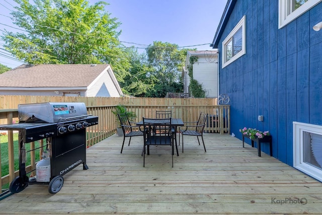 9130 S Greenwood Ave, Chicago, IL 60619 - deck featuring a grill, a fenced backyard, and outdoor dining space