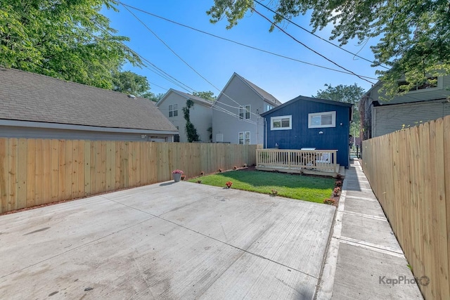 9130 S Greenwood Ave, Chicago, IL 60619 - fenced backyard featuring a patio area and an outbuilding