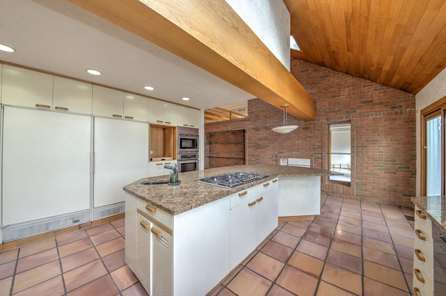 8170 Lake Ridge Dr, Burr Ridge, IL 60527 - kitchen featuring brick wall, stainless steel appliances, vaulted ceiling, light tile patterned floors, and white cabinetry