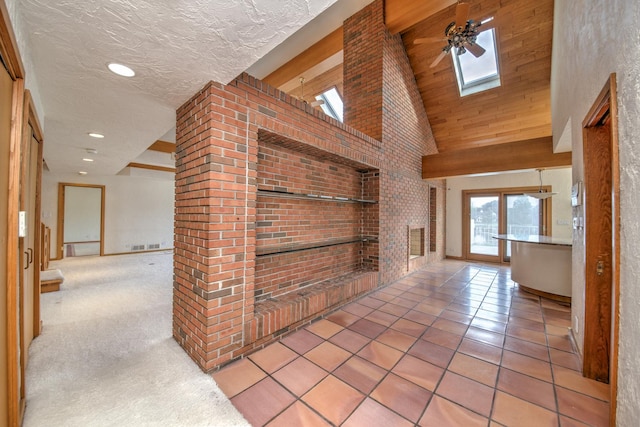 8170 Lake Ridge Dr, Burr Ridge, IL 60527 - corridor featuring a skylight, a towering ceiling, tile patterned floors, and recessed lighting