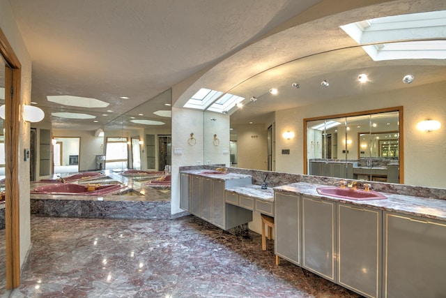 8170 Lake Ridge Dr, Burr Ridge, IL 60527 - full bath with a skylight, vanity, a bath, and marble finish flooring