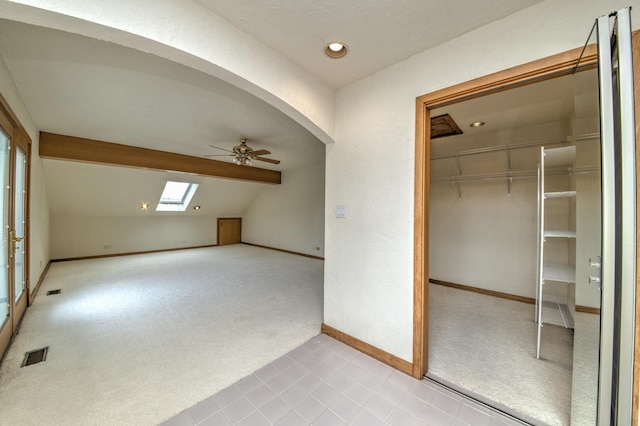 8170 Lake Ridge Dr, Burr Ridge, IL 60527 - additional living space with a skylight, a ceiling fan, carpet flooring, and lofted ceiling